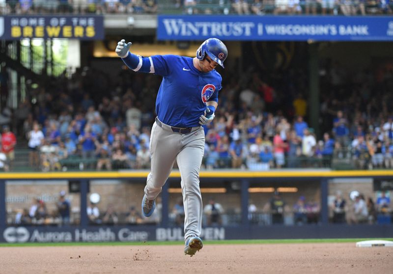 Jun 29, 2024; Milwaukee, Wisconsin, USA; Chicago Cubs outfielder Ian Happ (8) rounds the bases after hitting a home run against the Milwaukee Brewers in the eighth inning at American Family Field. Mandatory Credit: Michael McLoone-USA TODAY Sports