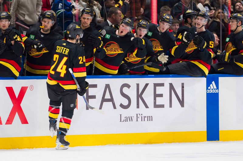 Dec 23, 2023; Vancouver, British Columbia, CAN; Vancouver Canucks forward Pius Suter (24) celebrates his goal against the San Jose Sharks in the third period at Rogers Arena. Canucks won 7-4. Mandatory Credit: Bob Frid-USA TODAY Sports