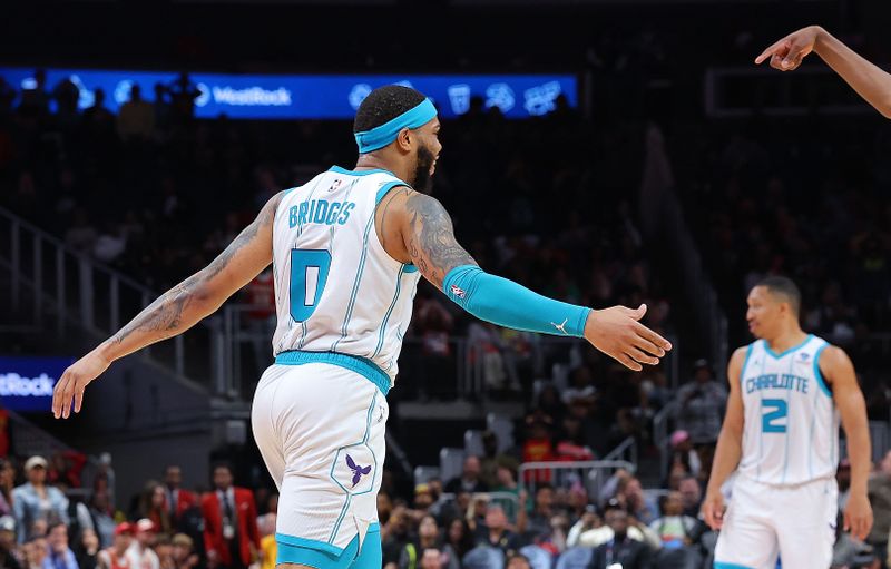 ATLANTA, GEORGIA - APRIL 10:  Miles Bridges #0 of the Charlotte Hornets reacts after hitting the game-winning basket against the Atlanta Hawks in the final seconds of the fourth quarter at State Farm Arena on April 10, 2024 in Atlanta, Georgia.  NOTE TO USER: User expressly acknowledges and agrees that, by downloading and/or using this photograph, user is consenting to the terms and conditions of the Getty Images License Agreement.  (Photo by Kevin C. Cox/Getty Images)