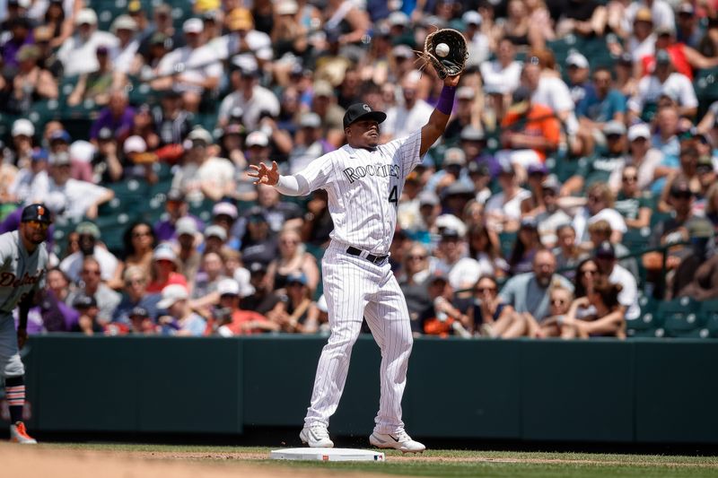 Jul 2, 2023; Denver, Colorado, USA; Colorado Rockies first baseman Elehuris Montero (44) fields a throw in the fourth inning against the Detroit Tigers at Coors Field. Mandatory Credit: Isaiah J. Downing-USA TODAY Sports