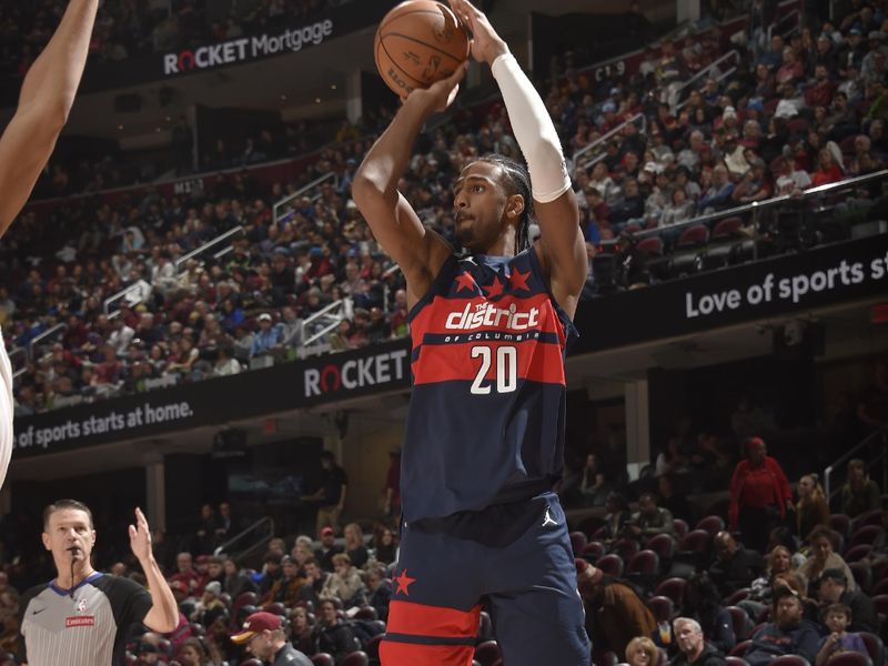 CLEVELAND, OH - DECEMBER 13: Alexandre Sarr #20 of the Washington Wizards shoots a three point basket during the game against the Cleveland Cavaliers on December 13, 2024 at Rocket Mortgage FieldHouse in Cleveland, Ohio. NOTE TO USER: User expressly acknowledges and agrees that, by downloading and/or using this Photograph, user is consenting to the terms and conditions of the Getty Images License Agreement. Mandatory Copyright Notice: Copyright 2024 NBAE (Photo by David Liam Kyle/NBAE via Getty Images)