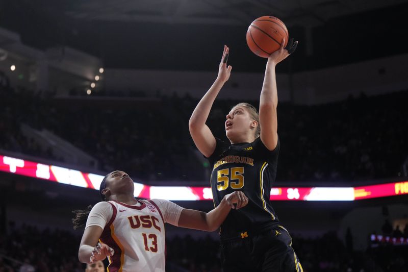 Dec 29, 2024; Los Angeles, California, USA; Michigan Wolverines center Yulia Grabovskaia (55) shoots the ball against Southern California Trojans center Rayah Marshall (13) in the second half at Galen Center. Mandatory Credit: Kirby Lee-Imagn Images