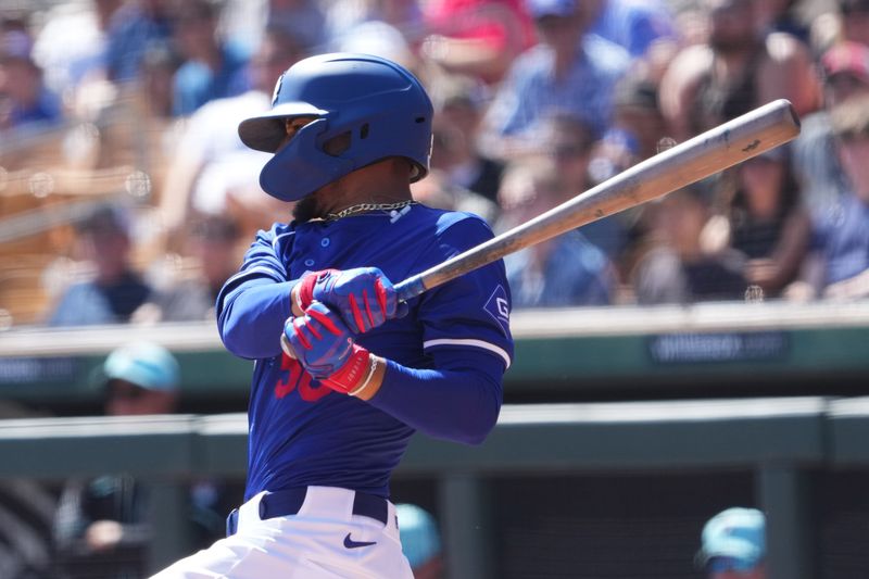 Mar 10, 2024; Phoenix, Arizona, USA; Los Angeles Dodgers infielder Mookie Betts (50) bats against the Arizona Diamondbacks during the first inning at Camelback Ranch-Glendale. Mandatory Credit: Joe Camporeale-USA TODAY Sports