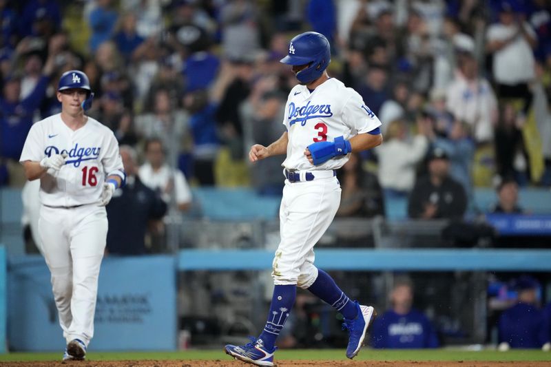 Jun 15, 2023; Los Angeles, California, USA; Los Angeles Dodgers third baseman Chris Taylor (3) scores on a walk-off single in the 11th inning against the Chicago White Sox at Dodger Stadium. Mandatory Credit: Kirby Lee-USA TODAY Sports