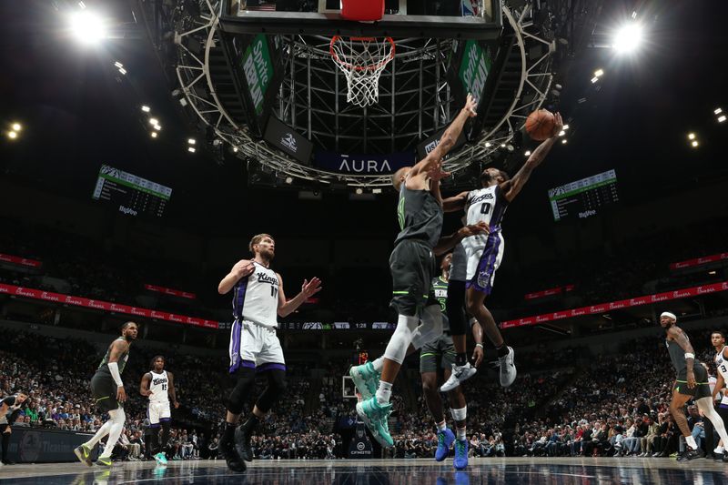 MINNEAPOLIS, MN -  MARCH 1: Malik Monk #0 of the Sacramento Kings drives to the basket during the game against the Minnesota Timberwolves on March 1, 2024 at Target Center in Minneapolis, Minnesota. NOTE TO USER: User expressly acknowledges and agrees that, by downloading and or using this Photograph, user is consenting to the terms and conditions of the Getty Images License Agreement. Mandatory Copyright Notice: Copyright 2024 NBAE (Photo by David Sherman/NBAE via Getty Images)