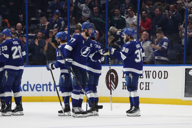Jan 30, 2025; Tampa, Florida, USA; Tampa Bay Lightning defenseman Victor Hedman (77) and left wing Brandon Hagel (38) celebrate after they defeating the Los Angeles Kings Amalie Arena. Mandatory Credit: Kim Klement Neitzel-Imagn Images