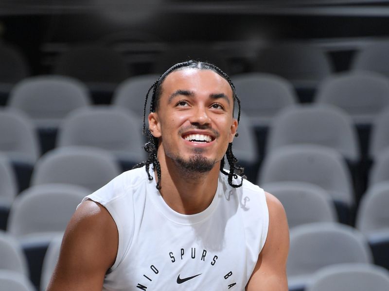 SAN ANTONIO, TX - OCTOBER 9: Tre Jones #33 of the San Antonio Spurs smiles before the game against the Orlando Magic during a NBA preseason game on October 9, 2024 at the Frost Bank Center in San Antonio, Texas. NOTE TO USER: User expressly acknowledges and agrees that, by downloading and or using this photograph, user is consenting to the terms and conditions of the Getty Images License Agreement. Mandatory Copyright Notice: Copyright 2024 NBAE (Photos by Michael Gonzales/NBAE via Getty Images)