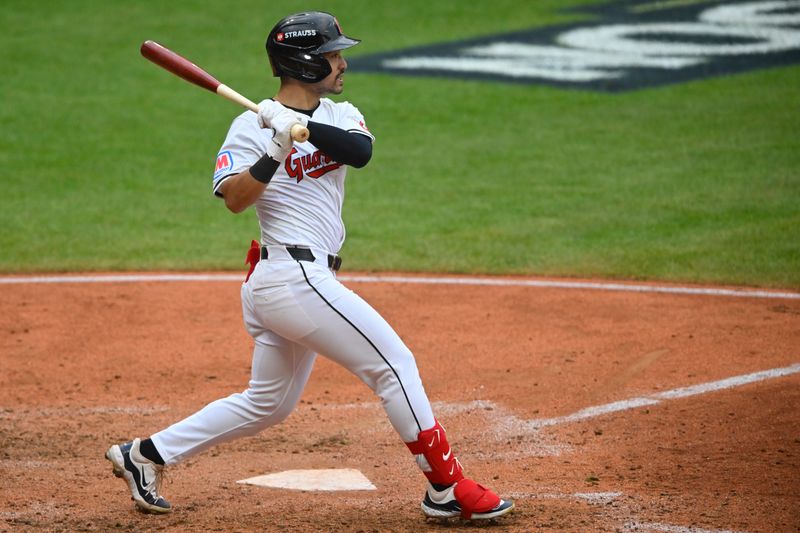 Oct 12, 2024; Cleveland, Ohio, USA; Cleveland Guardians outfielder Steven Kwan (38) hits a single in the seventh inning against the Detroit Tigers during game five of the ALDS for the 2024 MLB Playoffs at Progressive Field. Mandatory Credit: David Richard-Imagn Images