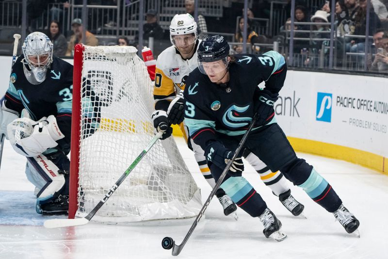 Feb 29, 2024; Seattle, Washington, USA; Seattle Kraken defenseman Will Borgen (3) skates against Pittsburgh Penguins forward Lars Eller (20) during the first period at Climate Pledge Arena. Mandatory Credit: Stephen Brashear-USA TODAY Sports