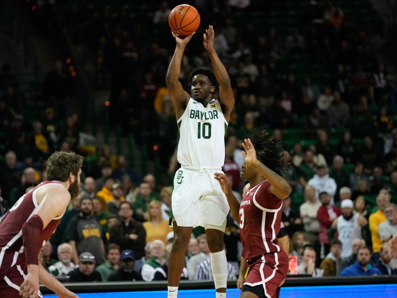 Feb 8, 2023; Waco, Texas, USA;  Baylor Bears guard Adam Flagler (10) scores a three point basket against Oklahoma Sooners guard Otega Oweh (3) during the second half at Ferrell Center. Mandatory Credit: Chris Jones-USA TODAY Sports