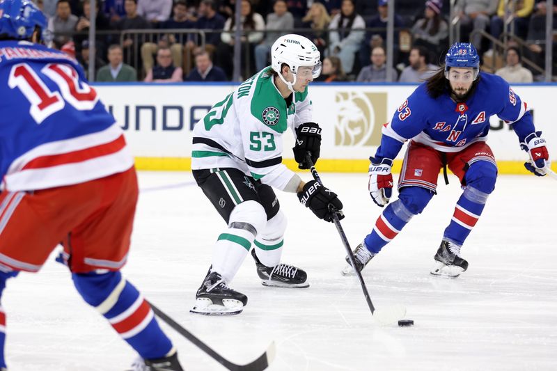 Feb 20, 2024; New York, New York, USA; Dallas Stars center Wyatt Johnston (53) skates with the puck against New York Rangers left wing Artemi Panarin (10) and center Mika Zibanejad (93) during the second period at Madison Square Garden. Mandatory Credit: Brad Penner-USA TODAY Sports