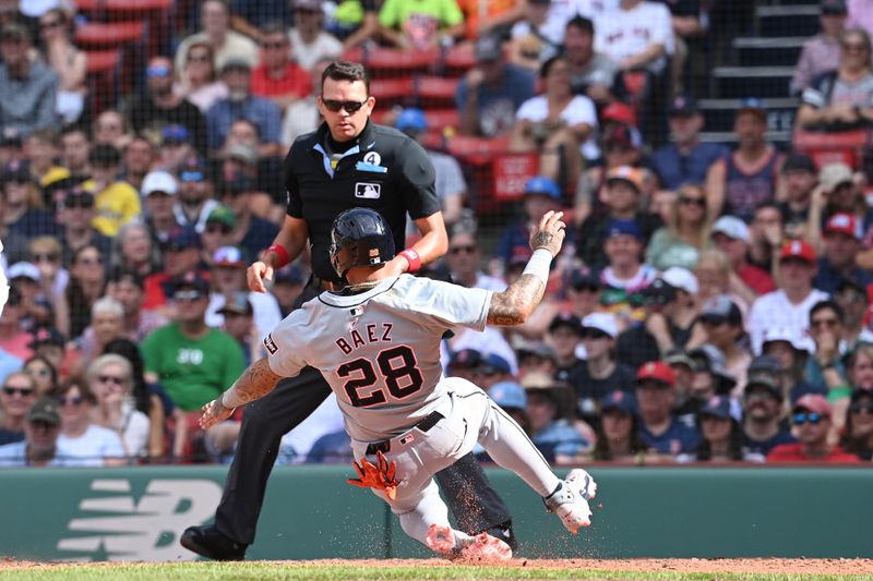 Jun 2, 2024; Boston, Massachusetts, USA;  Detroit Tigers shortstop Javier Baez (28) scores during the tenth inning against the Boston Red Sox at Fenway Park. Mandatory Credit: Eric Canha-USA TODAY Sports