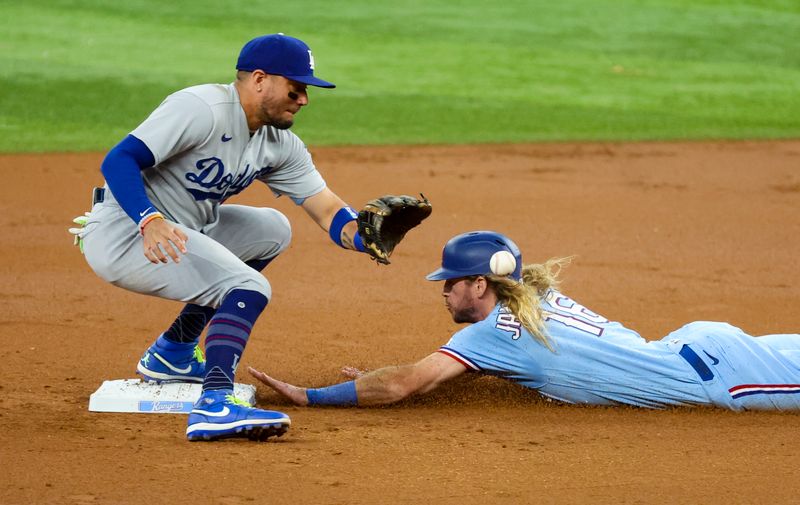 Jul 23, 2023; Arlington, Texas, USA;  Texas Rangers right fielder Travis Jankowski (16) steals second base ahead of the tag by Los Angeles Dodgers shortstop Miguel Rojas (11) during the first inning at Globe Life Field. Mandatory Credit: Kevin Jairaj-USA TODAY Sports