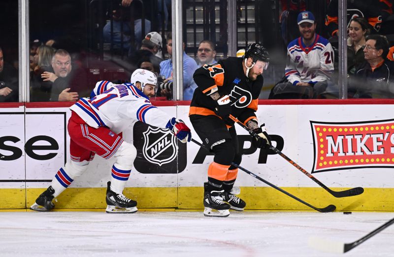 Nov 24, 2023; Philadelphia, Pennsylvania, USA; Philadelphia Flyers left wing Nicolas Deslauriers (44) shields the puck from New York Rangers center Barclay Goodrow (21) in the first period at Wells Fargo Center. Mandatory Credit: Kyle Ross-USA TODAY Sports