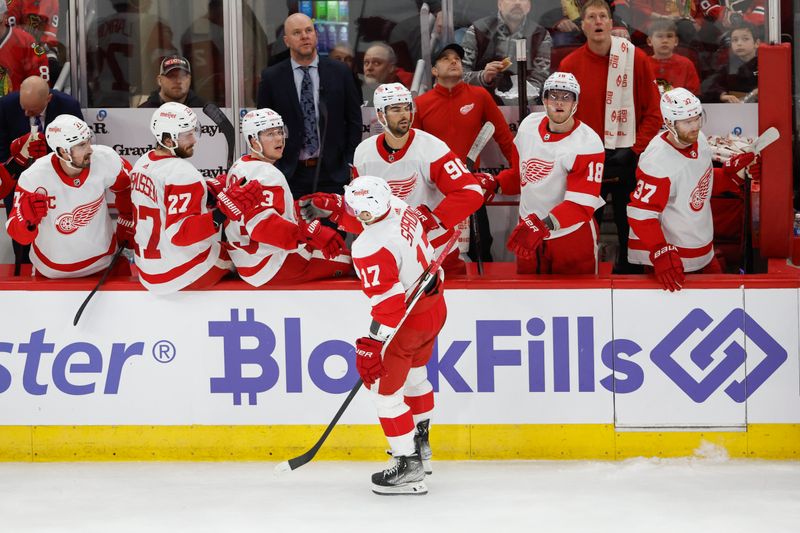 Feb 25, 2024; Chicago, Illinois, USA; Detroit Red Wings right wing Daniel Sprong (L) celebrates with teammates after scoring against the Chicago Blackhawks during the first period at United Center. Mandatory Credit: Kamil Krzaczynski-USA TODAY Sports