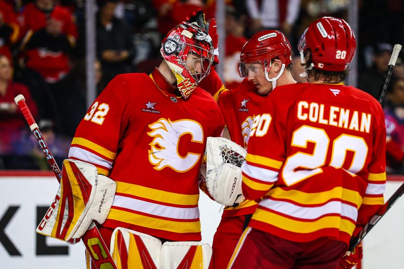 Jan 30, 2025; Calgary, Alberta, CAN; Calgary Flames goaltender Dustin Wolf (32) celebrate win with teammates after defeating the Anaheim Ducks at Scotiabank Saddledome. Mandatory Credit: Sergei Belski-Imagn Images