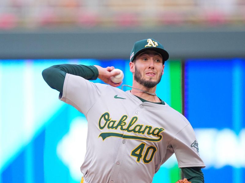 Jun 14, 2024; Minneapolis, Minnesota, USA; Oakland Athletics pitcher Mitch Spence (40) pitches against the Minnesota Twins in the second inning at Target Field. Mandatory Credit: Brad Rempel-USA TODAY Sports