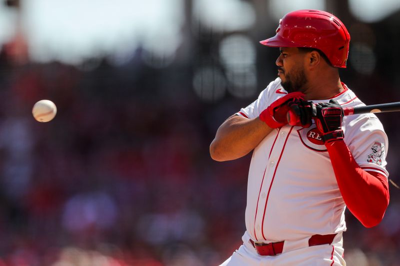 Apr 7, 2024; Cincinnati, Ohio, USA; Cincinnati Reds third baseman Jeimer Candelario (3) dodges a pitch in the sixth inning against the New York Mets at Great American Ball Park. Mandatory Credit: Katie Stratman-USA TODAY Sports