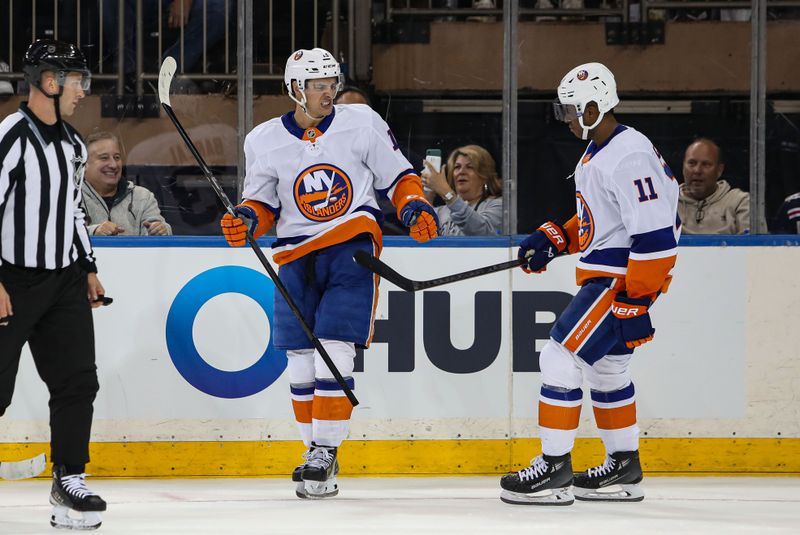 Sep 24, 2024; New York, New York, USA; New York Islanders center Mathew Barzal (13) celebrates his goal with left wing Anthony Duclair (11) during the second period against the New York Rangers at Madison Square Garden. Mandatory Credit: Danny Wild-Imagn Images