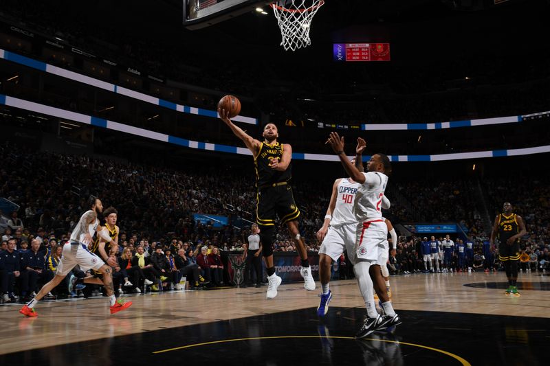 SAN FRANCISCO, CA - FEBRUARY 14: Stephen Curry #30 of the Golden State Warriors drives to the basket during the game against the LA Clippers on FEBRUARY 14, 2024 at Chase Center in San Francisco, California. NOTE TO USER: User expressly acknowledges and agrees that, by downloading and or using this photograph, user is consenting to the terms and conditions of Getty Images License Agreement. Mandatory Copyright Notice: Copyright 2024 NBAE (Photo by Noah Graham/NBAE via Getty Images)