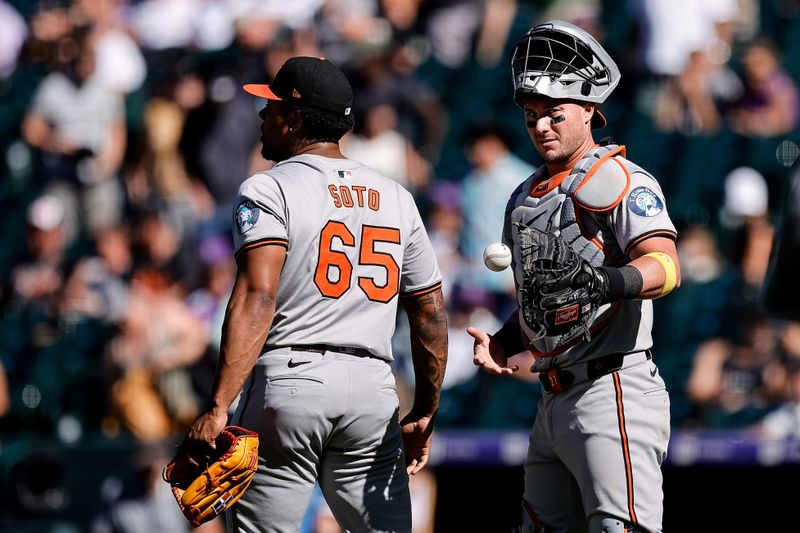 Sep 1, 2024; Denver, Colorado, USA; Baltimore Orioles relief pitcher Gregory Soto (65) celebrates with catcher James McCann (27) after the game against the Colorado Rockies at Coors Field. Mandatory Credit: Isaiah J. Downing-USA TODAY Sports