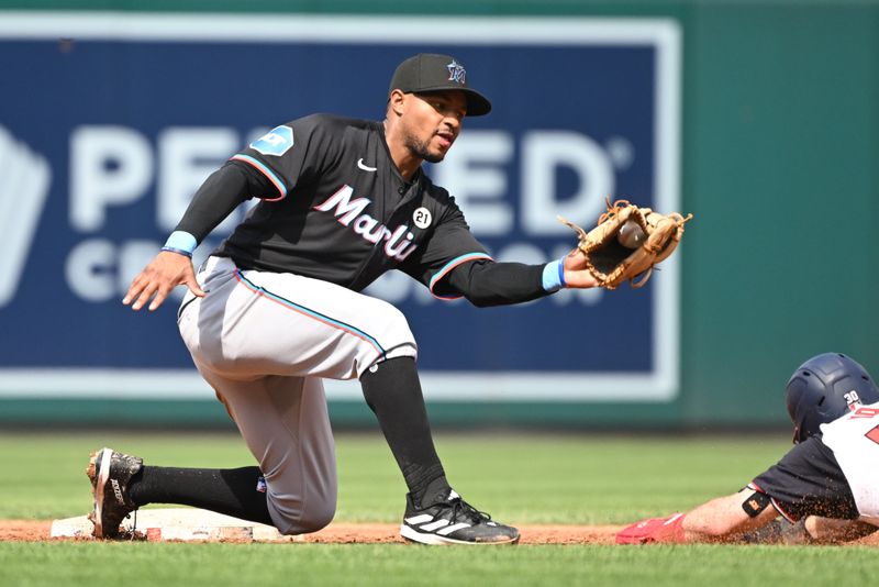 Sep 15, 2024; Washington, District of Columbia, USA; Miami Marlins second baseman Otto Lopez (61) fields the ball at second base during a stolen base attempt by Washington Nationals center fielder Jacob Young (30) during the third inning at Nationals Park. Mandatory Credit: Rafael Suanes-Imagn Images