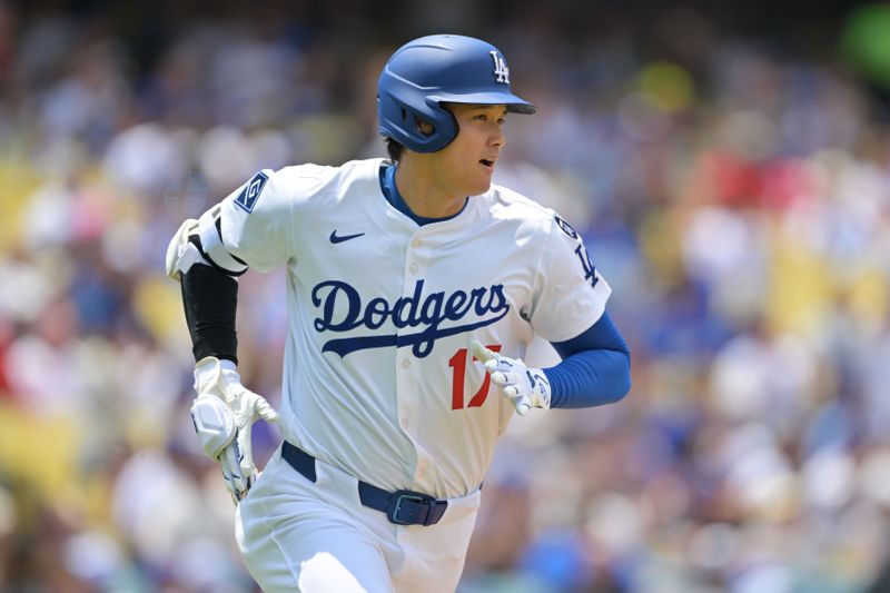 May 18, 2025; Los Angeles, California, USA; Los Angeles Dodgers two-way player Shohei Ohtani (17) runs after hitting a single in the third inning against the Los Angeles Angels at Dodger Stadium. Mandatory Credit: Jayne Kamin-Oncea-Imagn Images