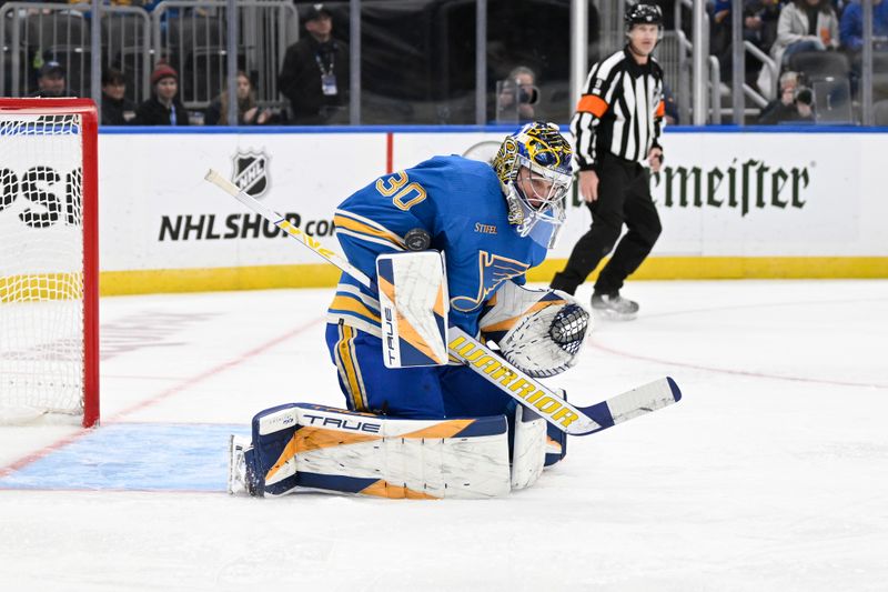 Nov 4, 2023; St. Louis, Missouri, USA; St. Louis Blues goaltender Joel Hofer (30) makes a save against Montreal Canadiens during the third period at Enterprise Center. Mandatory Credit: Jeff Le-USA TODAY Sports