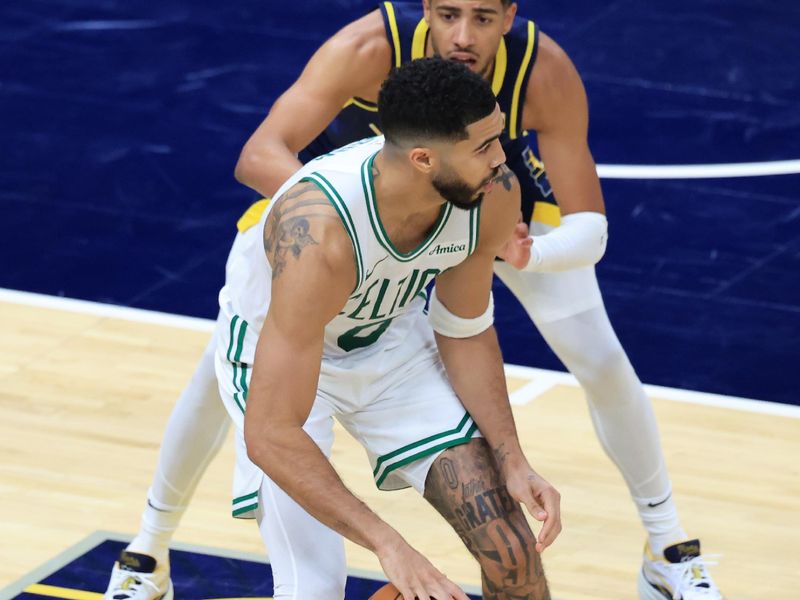 INDIANAPOLIS, INDIANA - OCTOBER 30: Jayson Tatum #0 of the Boston Celtics makes a move on Tyrese Haliburton #0 of the Indiana Pacers during the second half at Gainbridge Fieldhouse on October 30, 2024 in Indianapolis, Indiana. NOTE TO USER: User expressly acknowledges and agrees that, by downloading and or using this photograph, User is consenting to the terms and conditions of the Getty Images License Agreement. (Photo by Justin Casterline/Getty Images)