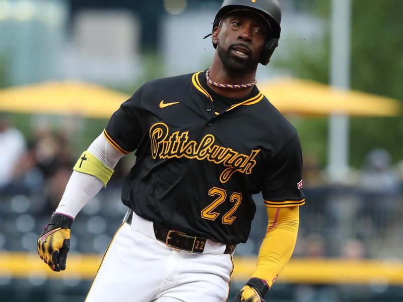 May 22, 2025; Pittsburgh, Pennsylvania, USA;  Pittsburgh Pirates designated hitter Andrew McCutchen (22) runs from first base to third base against the Milwaukee Brewers during the third inning at PNC Park. Mandatory Credit: Charles LeClaire-Imagn Images