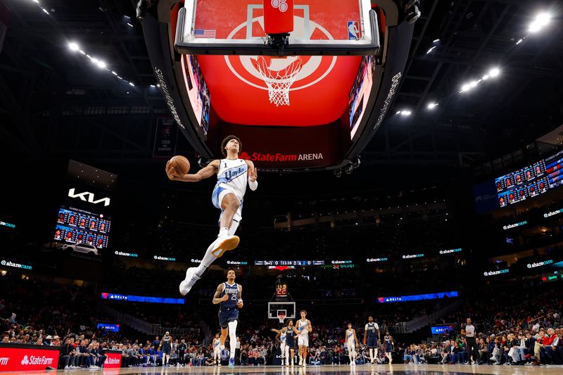 ATLANTA, GEORGIA - NOVEMBER 25: Jalen Johnson #1 of the Atlanta Hawks goes up for a dunk during the first half against the Dallas Mavericks at State Farm Arena on November 25, 2024 in Atlanta, Georgia. NOTE TO USER: User expressly acknowledges and agrees that, by downloading and or using this photograph, User is consenting to the terms and conditions of the Getty Images License Agreement. (Photo by Todd Kirkland/Getty Images)