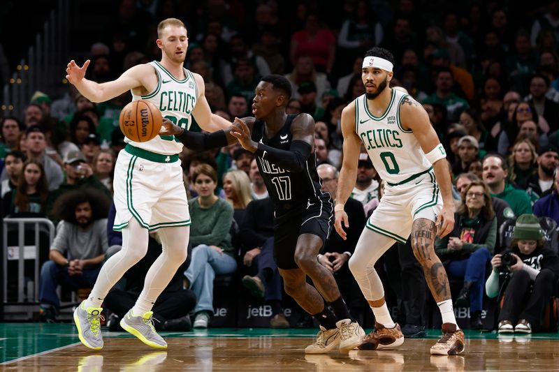 BOSTON, MA - FEBRUARY 14: Dennis Schroder #17 of the Brooklyn Nets passes out of a double team of Jayson Tatum #0 of the Boston Celtics and Sam Hauser #30 during the first quarter at TD Garden on February 14, 2024 in Boston, Massachusetts. NOTE TO USER: User expressly acknowledges and agrees that, by downloading and/or using this Photograph, user is consenting to the terms and conditions of the Getty Images License Agreement. (Photo By Winslow Townson/Getty Images)