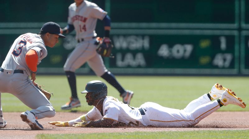 Apr 12, 2023; Pittsburgh, Pennsylvania, USA;  Pittsburgh Pirates designated hitter Andrew McCutchen (22) steals second base ahead of the tag of Houston Astros shortstop Jeremy Pena (3) during the first inning at PNC Park. Mandatory Credit: Charles LeClaire-USA TODAY Sports