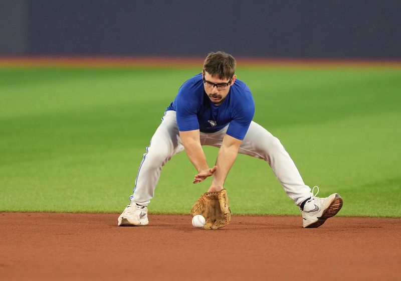 Aug 30, 2023; Toronto, Ontario, CAN; Toronto Blue Jays second baseman Davis Schneider (36) fields balls during batting practice before a game against the Washington Nationals at Rogers Centre. Mandatory Credit: Nick Turchiaro-USA TODAY Sports