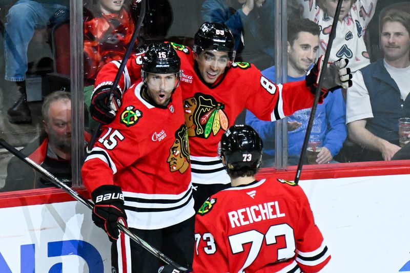 Oct 19, 2024; Chicago, Illinois, USA;  Chicago Blackhawks center Craig Smith (15) celebrates with center Andreas Athanasiou (89) after scoring a goal against the Buffalo Sabres during the second period at the United Center. Mandatory Credit: Matt Marton-Imagn Images