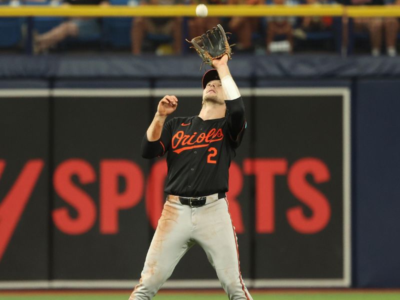 Aug 11, 2024; St. Petersburg, Florida, USA; Baltimore Orioles shortstop Gunnar Henderson (2) catches a fly ball against the Tampa Bay Rays during the seventh inning  at Tropicana Field. Mandatory Credit: Kim Klement Neitzel-USA TODAY Sports