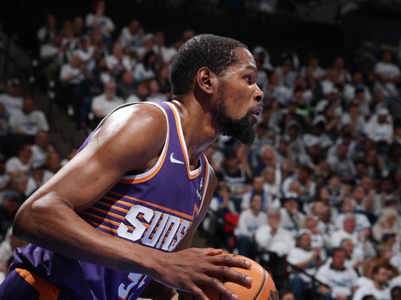 MINNEAPOLIS, MN -  APRIL 20: Kevin Durant #35 of the Phoenix Suns looks on during the game against the Minnesota Timberwolves during Round 1 Game 1 of the 2024 NBA Playoffs on April 20, 2024 at Target Center in Minneapolis, Minnesota. NOTE TO USER: User expressly acknowledges and agrees that, by downloading and or using this Photograph, user is consenting to the terms and conditions of the Getty Images License Agreement. Mandatory Copyright Notice: Copyright 2024 NBAE (Photo by David Sherman/NBAE via Getty Images)