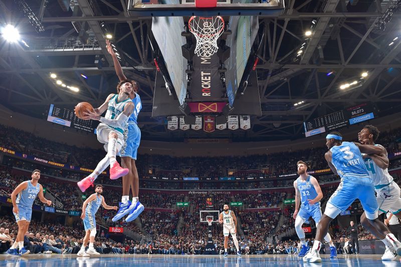 CLEVELAND, OH - NOVEMBER 17: LaMelo Ball #1 of the Charlotte Hornets drives to the basket during the game against the Cleveland Cavaliers on November 17, 2024 at Rocket Mortgage FieldHouse in Cleveland, Ohio. NOTE TO USER: User expressly acknowledges and agrees that, by downloading and/or using this Photograph, user is consenting to the terms and conditions of the Getty Images License Agreement. Mandatory Copyright Notice: Copyright 2024 NBAE (Photo by David Liam Kyle/NBAE via Getty Images)