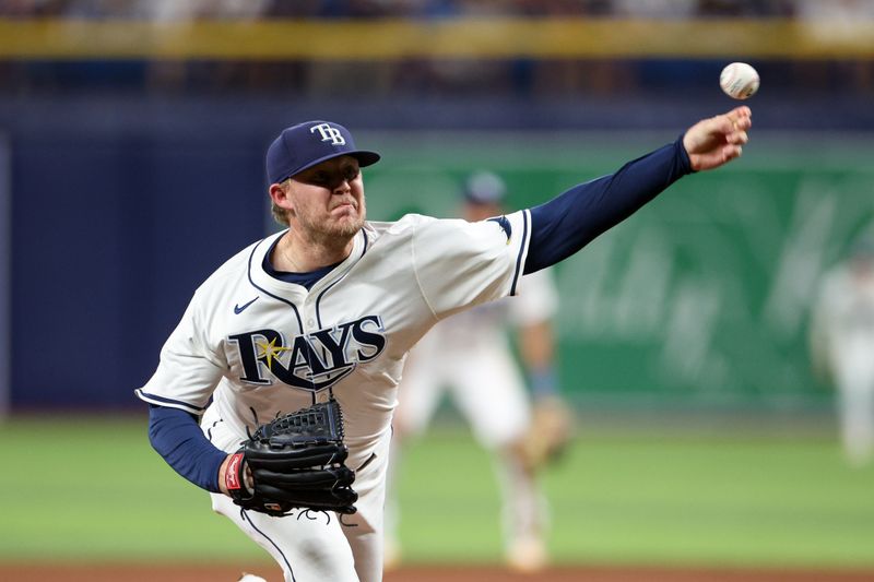 Jul 11, 2024; St. Petersburg, Florida, USA; Tampa Bay Rays pitcher Garrett Cleavinger (60) throws a pitch against the New York Yankees in the sixth inning at Tropicana Field. Mandatory Credit: Nathan Ray Seebeck-USA TODAY Sports