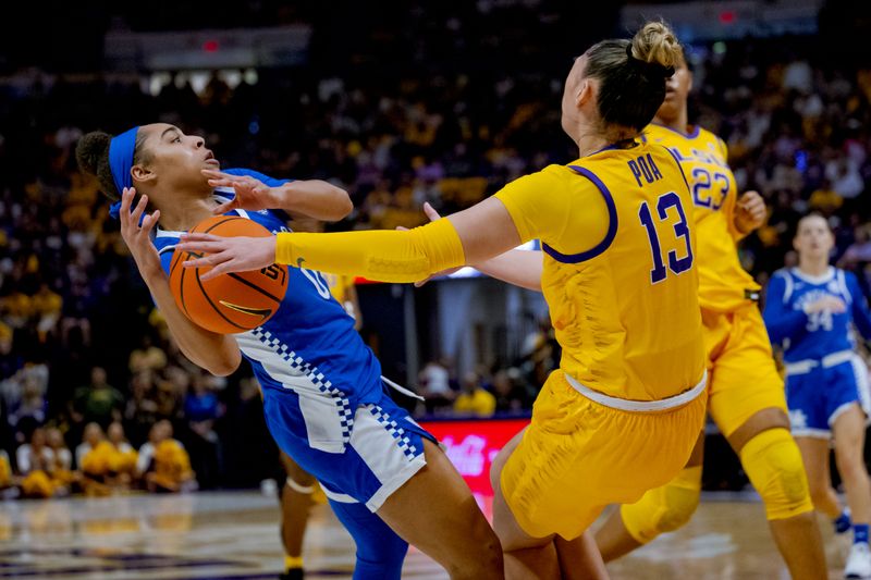 Mar 3, 2024; Baton Rouge, Louisiana, USA; Kentucky Wildcats guard Brooklynn Miles (0) collides with LSU Lady Tigers guard Last-Tear Poa (13) for Miles during the first half an offensive foul against at Pete Maravich Assembly Center. Mandatory Credit: Matthew Hinton-USA TODAY Sports