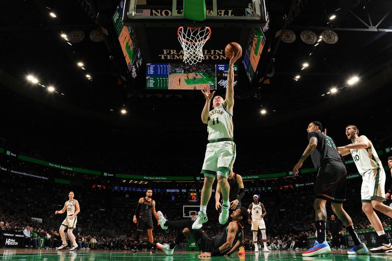 BOSTON, MA - FEBRUARY 9: Payton Pritchard #11 of the Boston Celtics drives to the basket during the game against the Washington Wizards on February 9, 2024 at the TD Garden in Boston, Massachusetts. NOTE TO USER: User expressly acknowledges and agrees that, by downloading and or using this photograph, User is consenting to the terms and conditions of the Getty Images License Agreement. Mandatory Copyright Notice: Copyright 2024 NBAE  (Photo by Brian Babineau/NBAE via Getty Images)