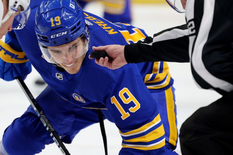 Mar 14, 2024; Buffalo, New York, USA;  Buffalo Sabres center Peyton Krebs (19) waits for the face-off during the second period against the New York Islanders at KeyBank Center. Mandatory Credit: Timothy T. Ludwig-USA TODAY Sports