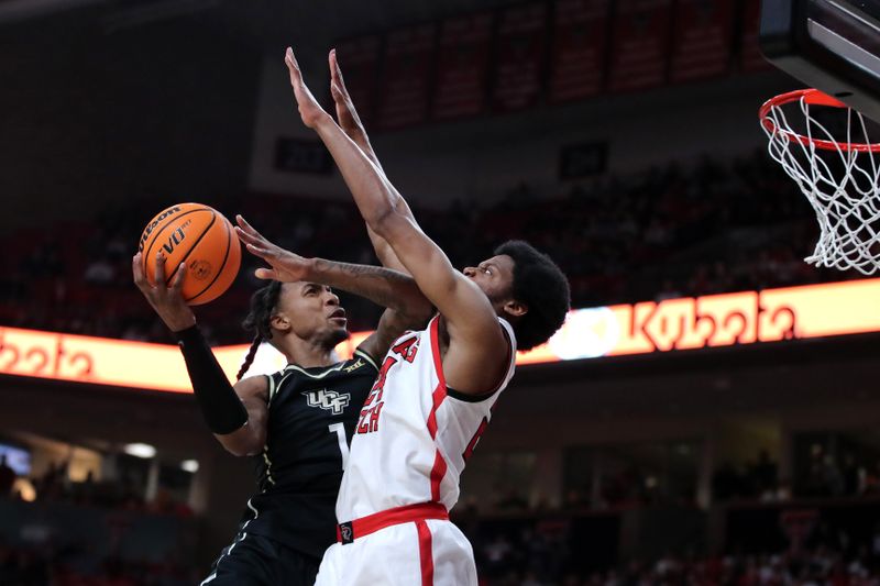 Feb 10, 2024; Lubbock, Texas, USA;  Texas Tech Red Raiders guard Kerwin Walton (24) blocks Central Florida Knights guard Antwann Jones (1) in the second half United Supermarkets Arena. Mandatory Credit: Michael C. Johnson-USA TODAY Sports