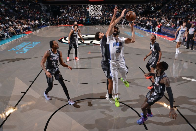 BROOKLYN, NY - DECEMBER 1:  Goga Bitadze #35 of the Orlando Magic drives to the basket during the game against the Brooklyn Nets on December 1, 2024 at Barclays Center in Brooklyn, New York. NOTE TO USER: User expressly acknowledges and agrees that, by downloading and or using this Photograph, user is consenting to the terms and conditions of the Getty Images License Agreement. Mandatory Copyright Notice: Copyright 2024 NBAE (Photo by Jesse D. Garrabrant/NBAE via Getty Images)