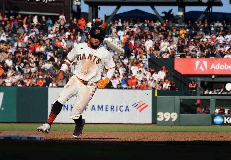 Aug 27, 2023; San Francisco, California, USA; San Francisco Giants right fielder Luis Matos (29) reaches third base against the Atlanta Braves during the fifth inning at Oracle Park. Mandatory Credit: Kelley L Cox-USA TODAY Sports