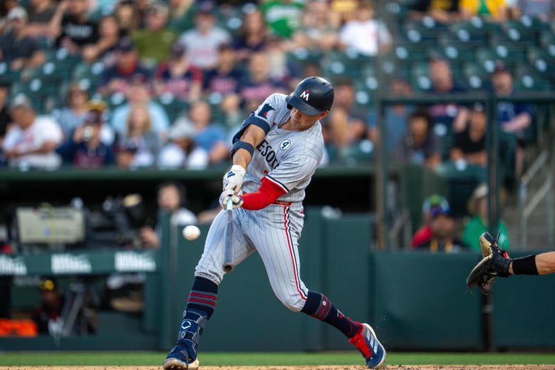 Jun 2, 2025; West Sacramento, California, USA; Minnesota Twins third baseman Brooks Lee (2) hits a RBI double against the Athletics during the second inning at Sutter Health Park. Mandatory Credit: Neville E. Guard-Imagn Images