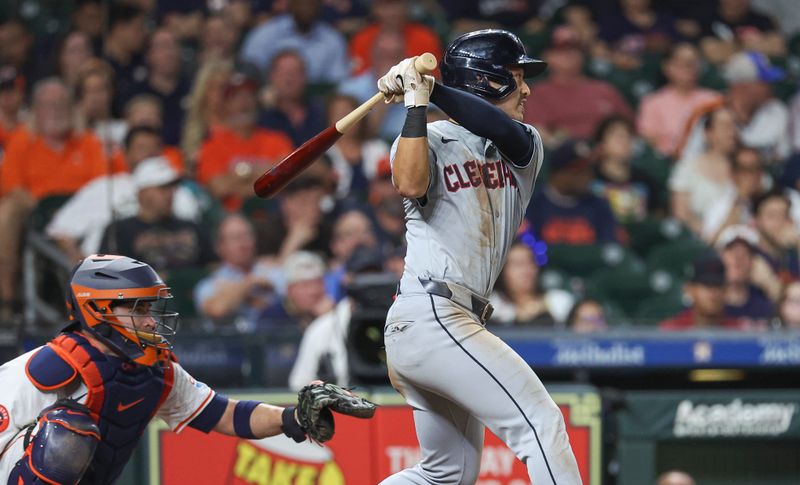 May 1, 2024; Houston, Texas, USA;  Cleveland Guardians left fielder Steven Kwan (38) hits an RBI double during the tenth inning against the Houston Astros at Minute Maid Park. Mandatory Credit: Troy Taormina-USA TODAY Sports