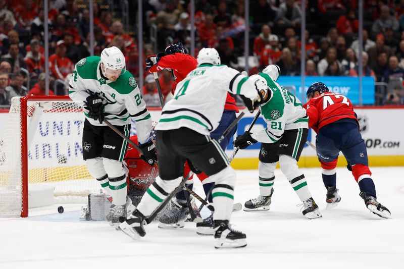 Oct 17, 2024; Washington, District of Columbia, USA; Dallas Stars left wing Jason Robertson (21) scores a goal on Washington Capitals goaltender Charlie Lindgren (79) in the second period at Capital One Arena. Mandatory Credit: Geoff Burke-Imagn Images