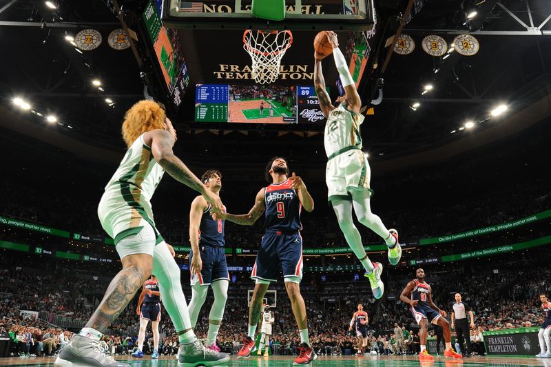 BOSTON, MA - APRIL 14: Oshae Brissett #12 of the Boston Celtics dunks the ball during the game  against the Washington Wizards on April 14, 2024 at the TD Garden in Boston, Massachusetts. NOTE TO USER: User expressly acknowledges and agrees that, by downloading and or using this photograph, User is consenting to the terms and conditions of the Getty Images License Agreement. Mandatory Copyright Notice: Copyright 2024 NBAE  (Photo by Brian Babineau/NBAE via Getty Images)