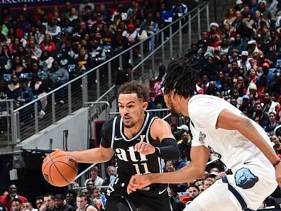 ATLANTA, GA - DECEMBER 23: Trae Young #11 of the Atlanta Hawks handles the ball during the game against the Memphis Grizzlies on December 23, 2023 at State Farm Arena in Atlanta, Georgia.  NOTE TO USER: User expressly acknowledges and agrees that, by downloading and/or using this Photograph, user is consenting to the terms and conditions of the Getty Images License Agreement. Mandatory Copyright Notice: Copyright 2023 NBAE (Photo by Scott Cunningham/NBAE via Getty Images)